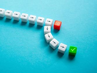 arrows on cubes disrupted by a red cube, then taking a different direction